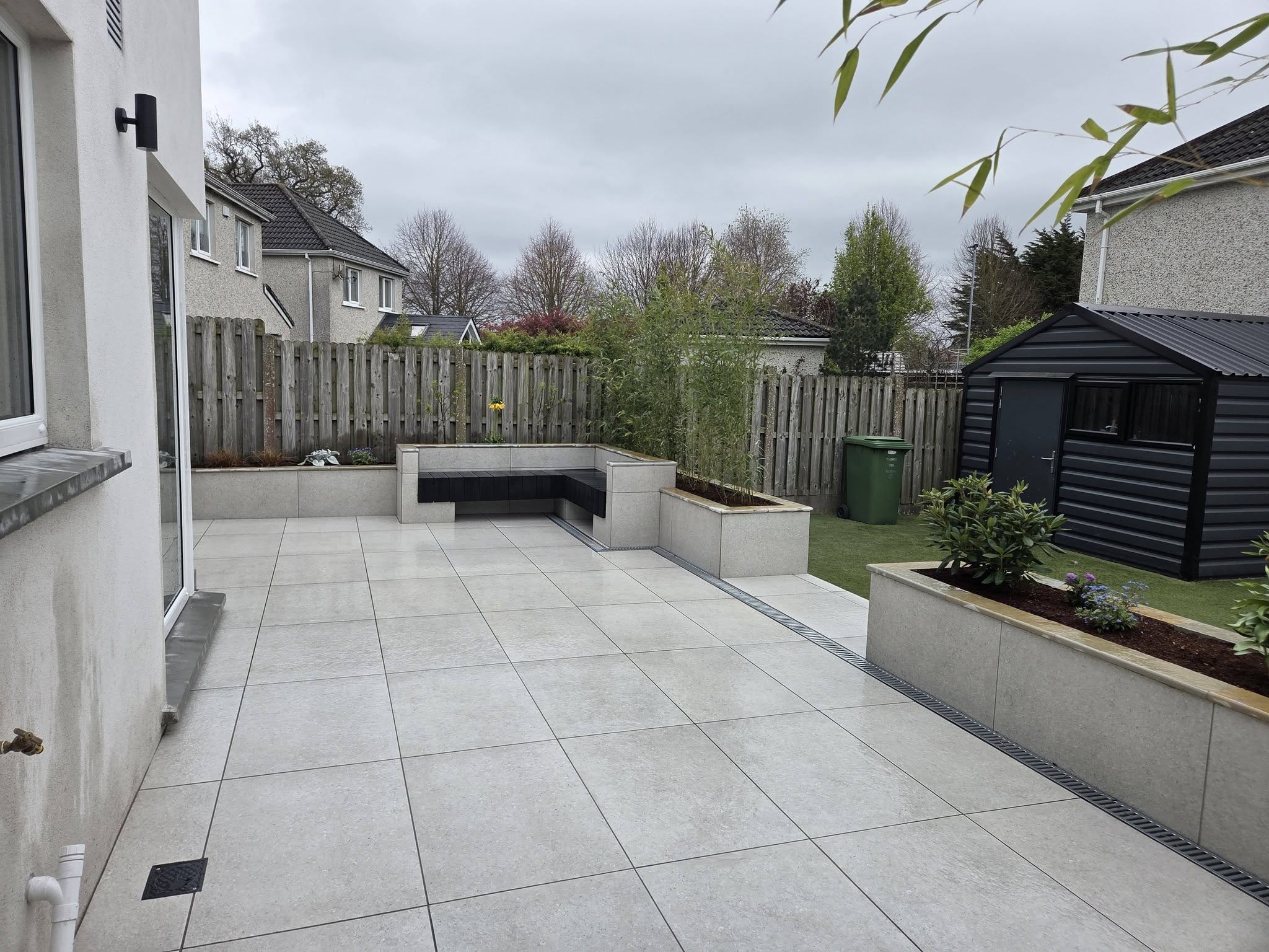 Modern tiled patio with built-in bench