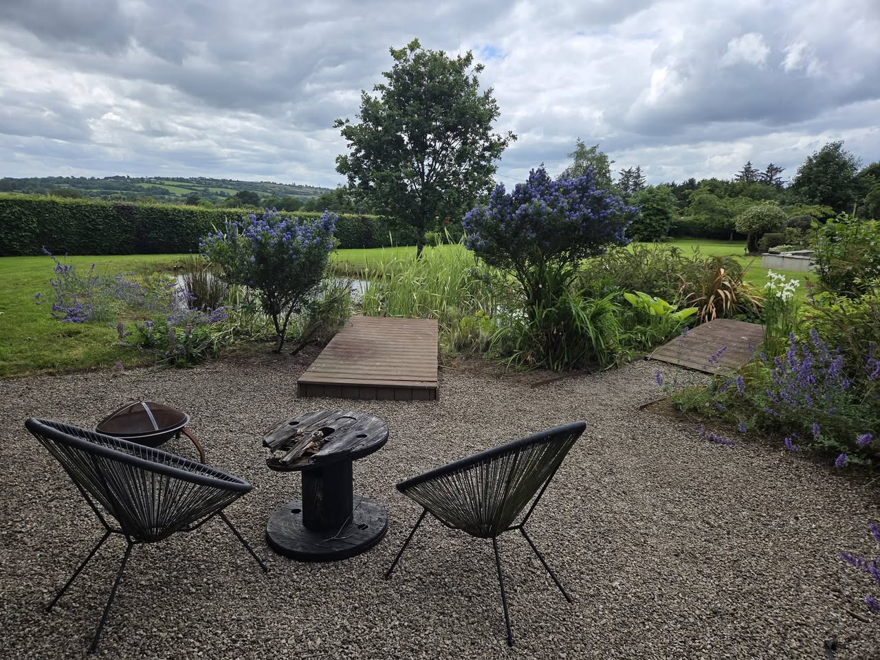 Gravel seating area and garden pond