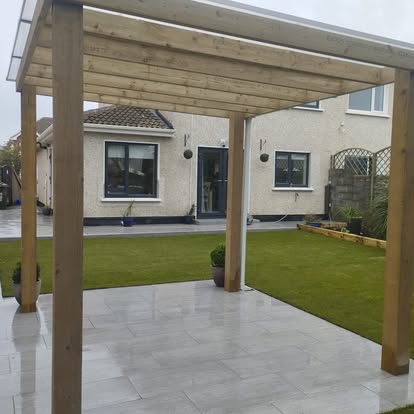 Wooden pergola over stone patio