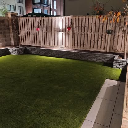 Stone retaining wall and artificial grass